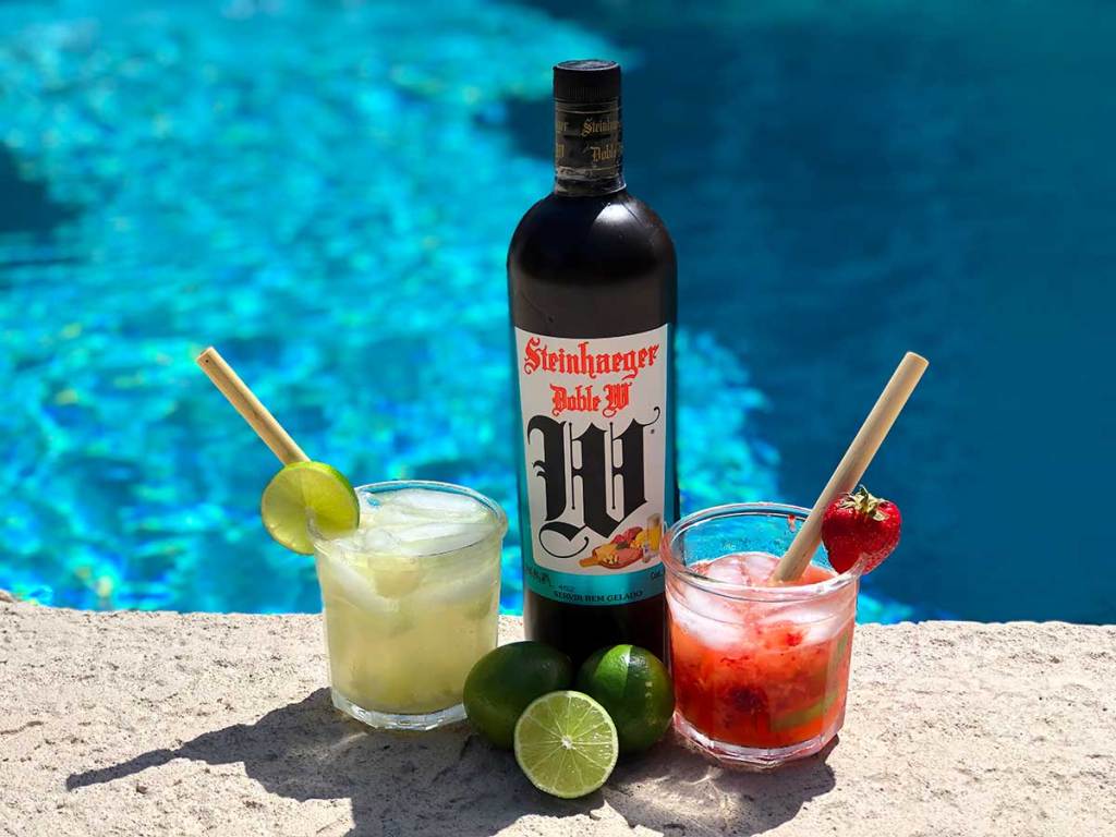 Caipirinhas and limes by a pool