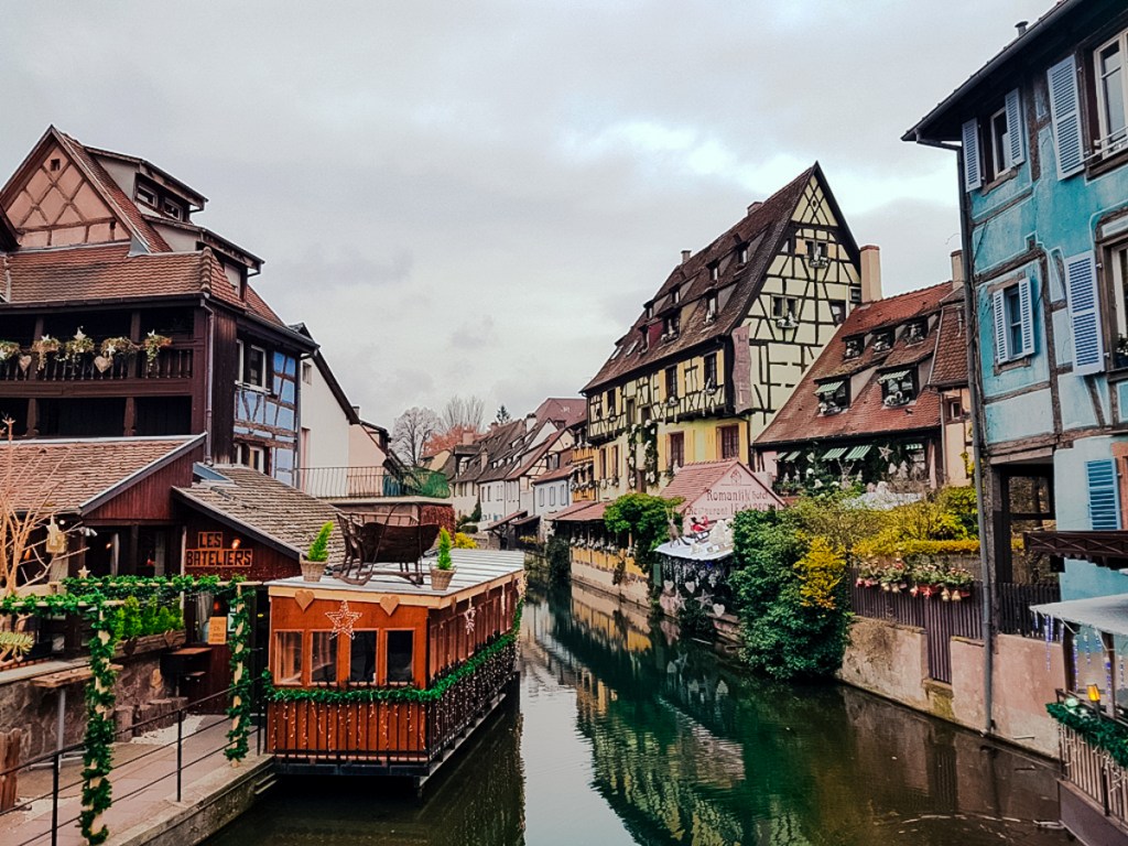 The German-influenced houses on a canal in Colmar, one of the best cities in France to visit