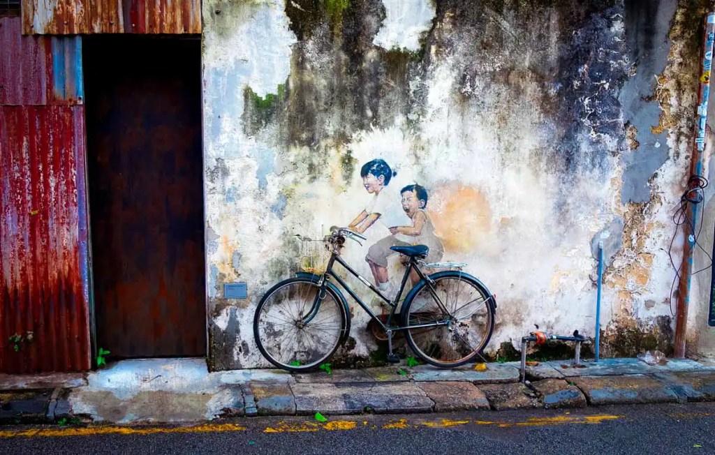 Penang street art "Siblings On A Bike"