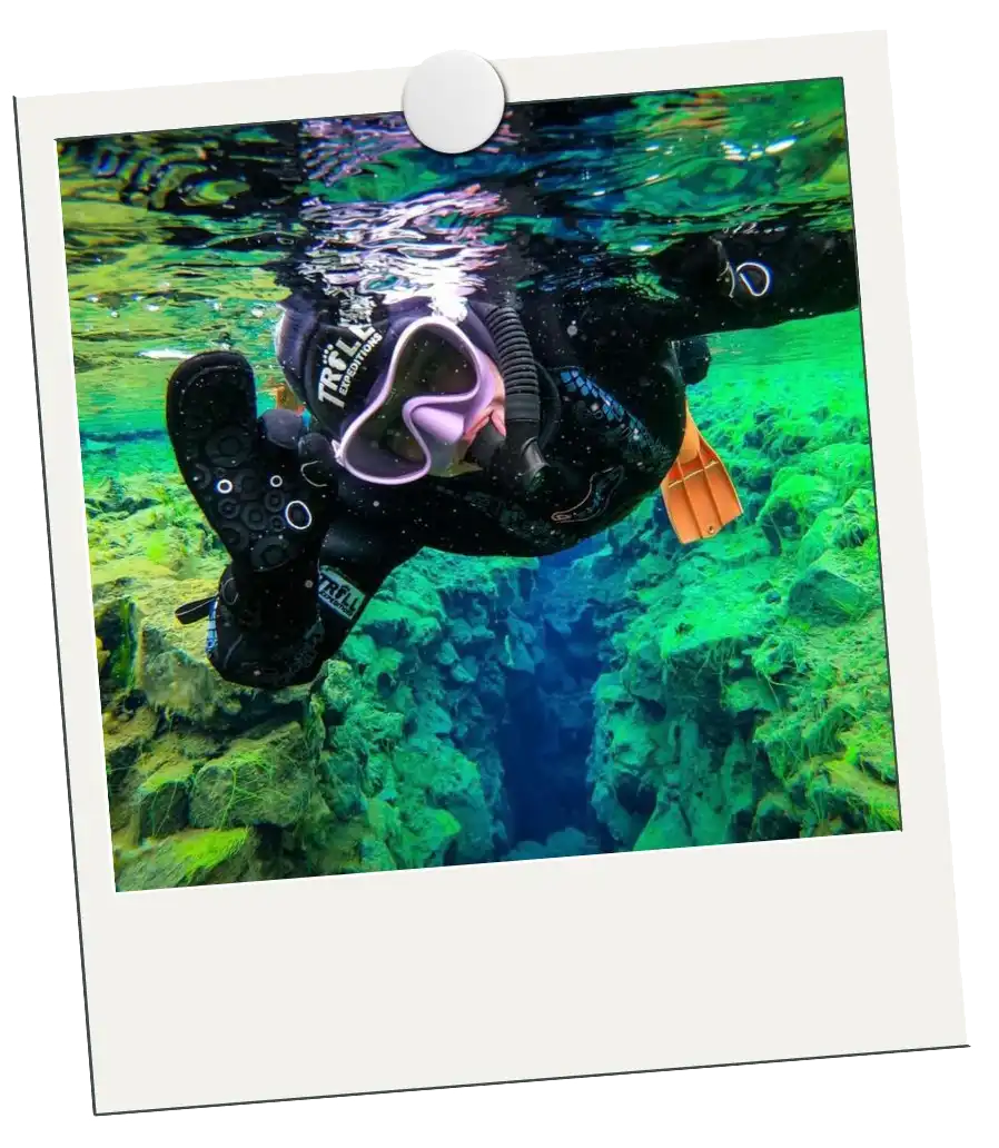 Travel Inspo polaroid of Jordan snorkeling between tectonic plates in Iceland